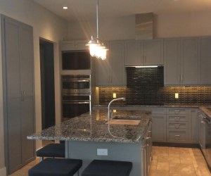 Custom grey cabinets and pantry doors