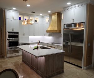 White cabinets with an oak island