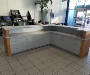 L shaped desk with white cabinets
