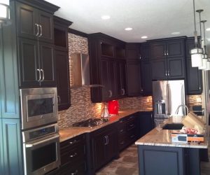 Dark stained wood cabinets and drawers