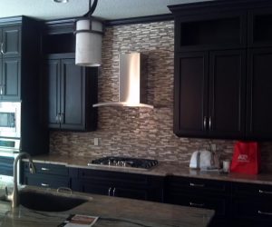 Dark stained wood cabinets and drawers