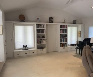 White bookcase with white drawers on the bottom