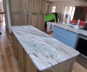 Oak wood island with marble countertop