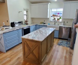 Oak wood island with marble countertop