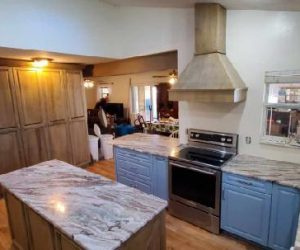 Oak wood island with marble countertop