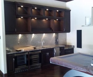 Dark stained wood cabinets and shelves