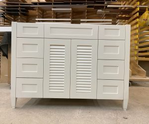 Small white vanity with cabinets and drawers