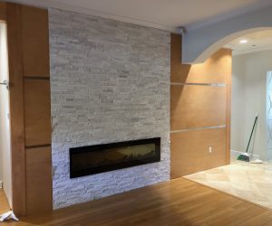 White brick fireplace on an oak wood wall