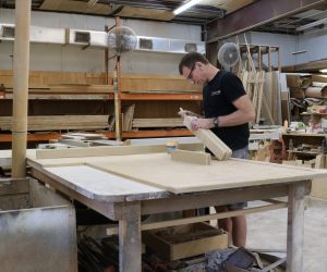 Woodworker detailing wood