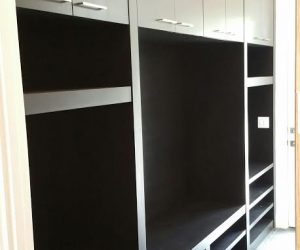 custom dark wood shelves and cabinets